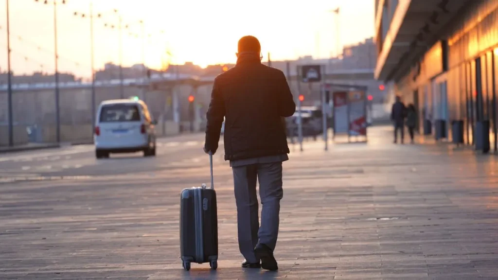 Neatly packed carry-on suitcase with rolled clothes showing carry-on packing tips in action