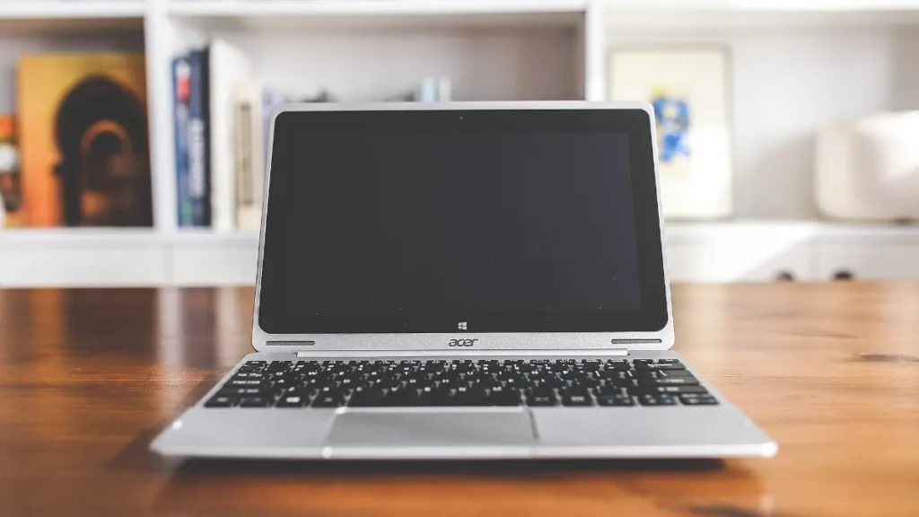 Tidy desk with open laptop showing how to organize your digital life