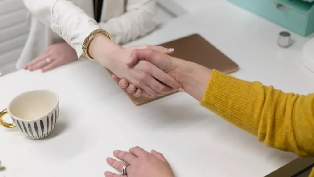 Office meeting handshake after learning how to prepare for a job interview